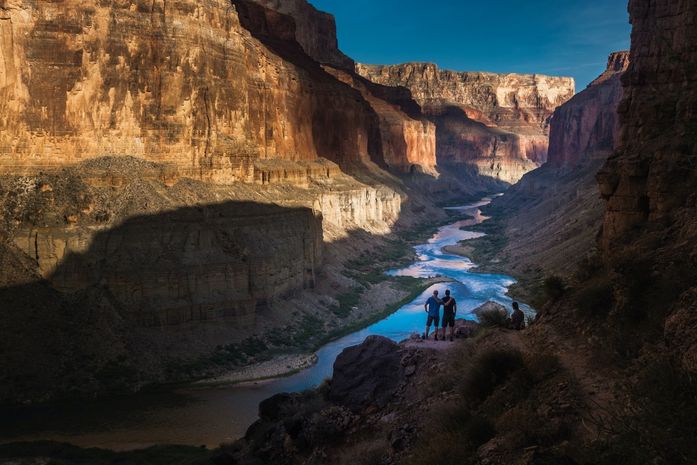 Hikers enjoying a moment at the base of the Grand Canyon