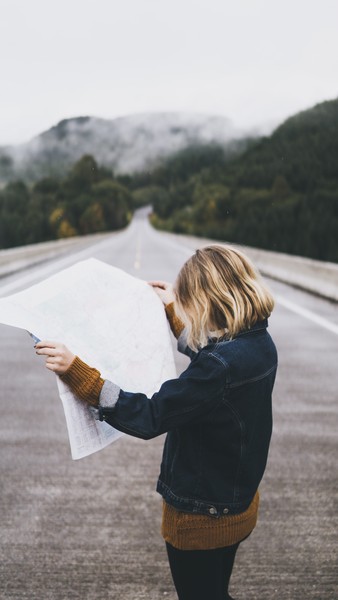 A hiker finding their bearing on the map