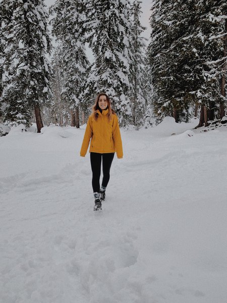 A hiker in winter wearing fitting leggings