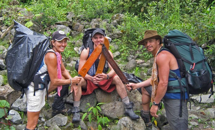 A group of hikers wearing different types of hiking hats