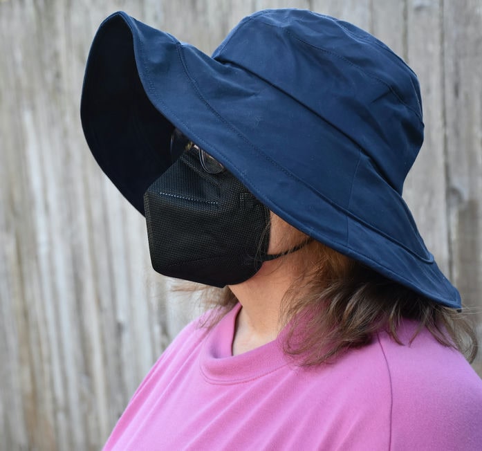A wide-rim hiking hat protects the face and eyes from the scorching sun